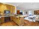 Gourmet kitchen featuring granite countertops, custom cabinets, and stainless steel appliances at 5200 Moore Rd, Suwanee, GA 30024