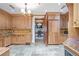 Spacious kitchen showcasing custom cabinets, granite counters, and stainless steel appliances at 5200 Moore Rd, Suwanee, GA 30024