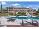 Stunning backyard pool with lounge seating, with the brick mansion as the backdrop at 5200 Moore Rd, Suwanee, GA 30024