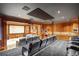 Home theater with tiered seating and wet bar for the ultimate movie-watching experience at 5200 Moore Rd, Suwanee, GA 30024