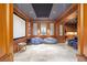 Home theater with custom wood trim, ambient lighting, and comfortable seating at 5200 Moore Rd, Suwanee, GA 30024