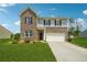 Charming two-story brick home with a well-manicured lawn and a two car garage at 7247 Emma Ct, Douglasville, GA 30134