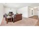 Living area with a view into an entry hallway with wood style flooring at 7247 Emma Ct, Douglasville, GA 30134