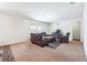 Open-concept living area featuring neutral tones and a decorative rug at 7247 Emma Ct, Douglasville, GA 30134