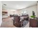 Spacious living room with views into the eat-in kitchen, neutral colors and TV at 7247 Emma Ct, Douglasville, GA 30134