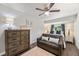 Spacious bedroom with dresser, couch and ceiling fan at 2479 Cedar Canyon Se Rd # 2479, Marietta, GA 30067