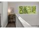 Small landing area with a desk and chair, offering a peaceful workspace at 2479 Cedar Canyon Se Rd # 2479, Marietta, GA 30067