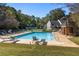 Community swimming pool with lounge chairs and green space at 2479 Cedar Canyon Se Rd # 2479, Marietta, GA 30067