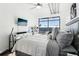 Main bedroom with city view, large window, and ceiling fan at 260 18Th Nw St # 10226, Atlanta, GA 30363