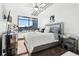 Spacious bedroom with large window, ceiling fan and city view at 260 18Th Nw St # 10226, Atlanta, GA 30363