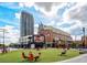 Vibrant community square with green space, modern seating, and city skyline views at 260 18Th Nw St # 10226, Atlanta, GA 30363