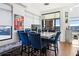 Modern dining area with marble table and blue velvet chairs near windows at 260 18Th Nw St # 10226, Atlanta, GA 30363