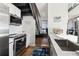 Modern kitchen with white cabinets, stainless steel appliances, and a breakfast bar at 260 18Th Nw St # 10226, Atlanta, GA 30363