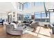 Spacious living room with large windows, city views, and a circular sectional sofa at 260 18Th Nw St # 10226, Atlanta, GA 30363