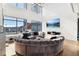 Open living space with circular sectional sofa and city views at 260 18Th Nw St # 10226, Atlanta, GA 30363