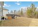 Private backyard with patio and wooded backdrop, creating a tranquil atmosphere at 5010 Ethans Cove Dr, Austell, GA 30106