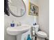 Small bathroom with pedestal sink and toilet at 5010 Ethans Cove Dr, Austell, GA 30106