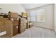 Empty bedroom with large window and carpet at 5010 Ethans Cove Dr, Austell, GA 30106