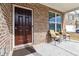 Front porch with two chairs and a side table at 5010 Ethans Cove Dr, Austell, GA 30106