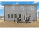 Gray house exterior with multiple windows and backyard at 5010 Ethans Cove Dr, Austell, GA 30106