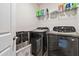 Laundry room with washer, dryer, and shelving at 5010 Ethans Cove Dr, Austell, GA 30106