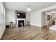 Spacious living room with fireplace and hardwood floors at 5010 Ethans Cove Dr, Austell, GA 30106