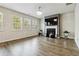 Spacious living room with fireplace and hardwood floors at 5010 Ethans Cove Dr, Austell, GA 30106