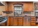 Kitchen with wood cabinets and granite counters at 2563 Young Rd, Stone Mountain, GA 30088