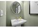 Small powder room with pedestal sink and sage green walls at 306 Skye Ln # 68, Cartersville, GA 30121