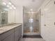 Bathroom with granite countertop, double vanity and shower at 3075 Westpoint Cir, Snellville, GA 30078