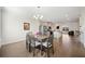 Open dining room with hardwood floors and view of kitchen at 3075 Westpoint Cir, Snellville, GA 30078