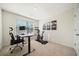 Bright home office features a standing desk, ergonomic chair, and Peloton exercise bike at 3075 Westpoint Cir, Snellville, GA 30078