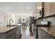Modern kitchen with stainless steel appliances and granite countertops at 3075 Westpoint Cir, Snellville, GA 30078