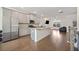 Eat-in kitchen with island, stainless steel appliances, and hardwood floors at 3075 Westpoint Cir, Snellville, GA 30078