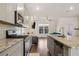 Open kitchen features granite island and stainless steel appliances at 3075 Westpoint Cir, Snellville, GA 30078