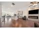Open living space with hardwood floors, fireplace, and kitchen views at 3075 Westpoint Cir, Snellville, GA 30078