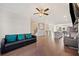 Open concept living area with hardwood floors, kitchen, and fireplace at 3075 Westpoint Cir, Snellville, GA 30078