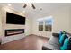 Living room with fireplace, hardwood floors, and large window at 3075 Westpoint Cir, Snellville, GA 30078