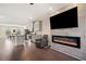 Open concept living area with hardwood floors, fireplace, and kitchen at 3075 Westpoint Cir, Snellville, GA 30078
