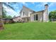 Spacious backyard with lush lawn and deck at 6231 Creekford Dr, Lithonia, GA 30058