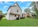 Large backyard with grassy area and modern home at 6231 Creekford Dr, Lithonia, GA 30058