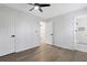 Bright bedroom with hardwood floors, ceiling fan, and access to bathroom at 6231 Creekford Dr, Lithonia, GA 30058
