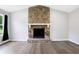 Large stone fireplace as a focal point in the living room at 6231 Creekford Dr, Lithonia, GA 30058