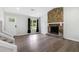 Living room with hardwood floors, fireplace, and access to backyard at 6231 Creekford Dr, Lithonia, GA 30058