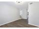 Open living area with wood-look floors and modern chandelier at 6231 Creekford Dr, Lithonia, GA 30058