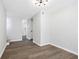Bright living area with wood-look floors and access to kitchen at 6231 Creekford Dr, Lithonia, GA 30058