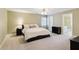 Bedroom featuring a bed, natural light, and neutral walls and carpet at 1449 Brentford Cv, Snellville, GA 30078