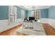 Bright home office featuring hardwood floors, natural light, and modern work setup at 1449 Brentford Cv, Snellville, GA 30078
