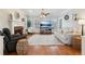 Bright living room with hardwood floors, neutral decor, and cozy seating arrangement at 1449 Brentford Cv, Snellville, GA 30078
