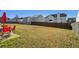 Spacious backyard with grassy area and wooden fence at 1762 Wood Stork Dr, Hampton, GA 30228